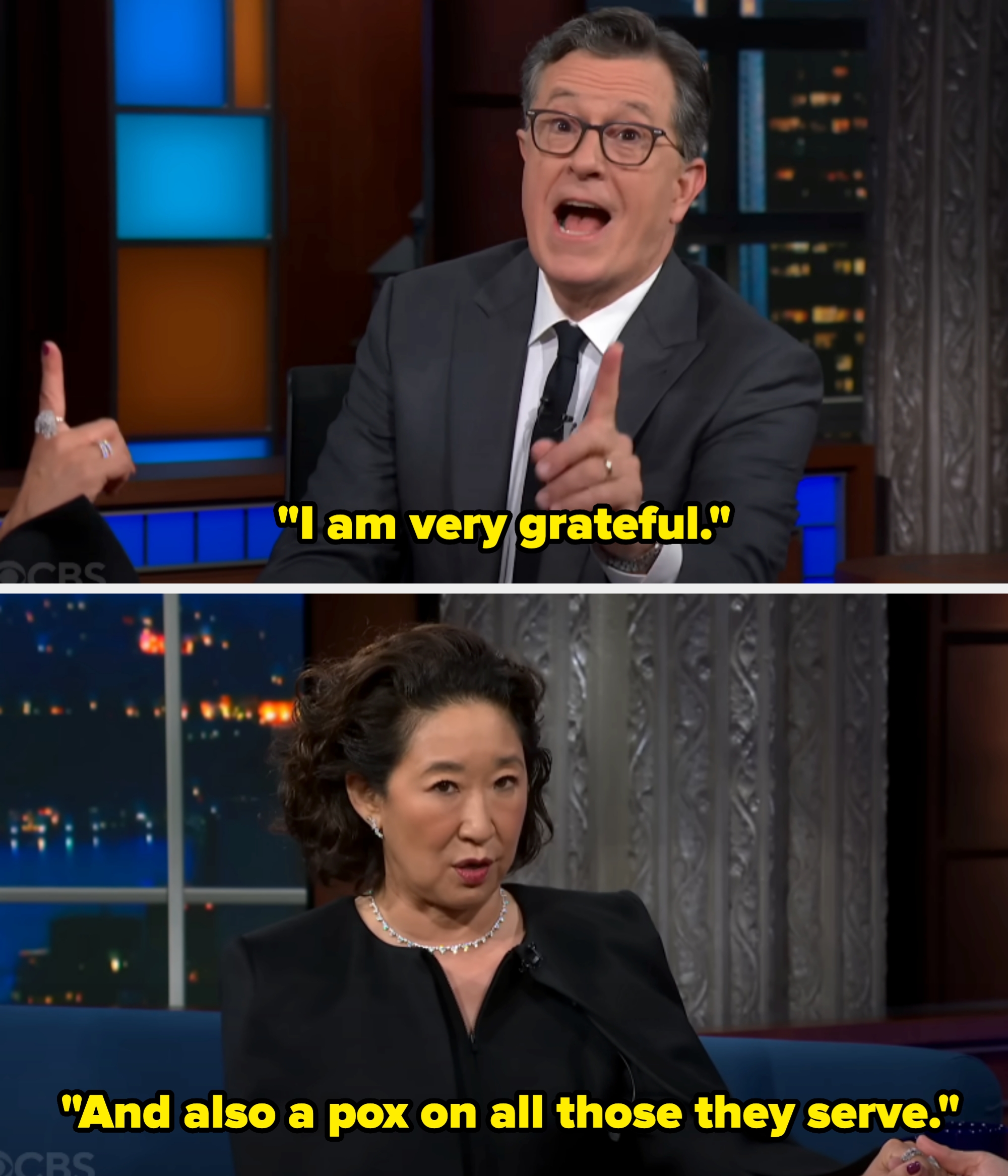 A man in a suit gestures animatedly while speaking on a talk show set