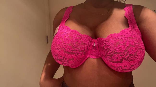 Person wearing a lace bra with floral patterns