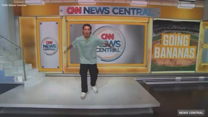 A person energetically dances in a news studio with a "CNN News Central" sign and "Going Bananas" displayed on a screen in the background