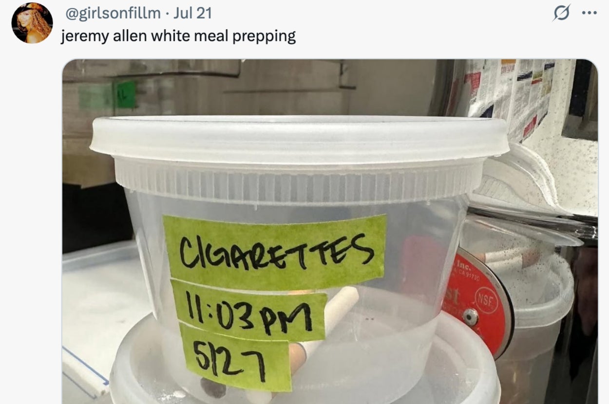 Labeled containers stacked, one prominently marked "Cigarettes" with a time and date note on it. Kitchen setting in the background