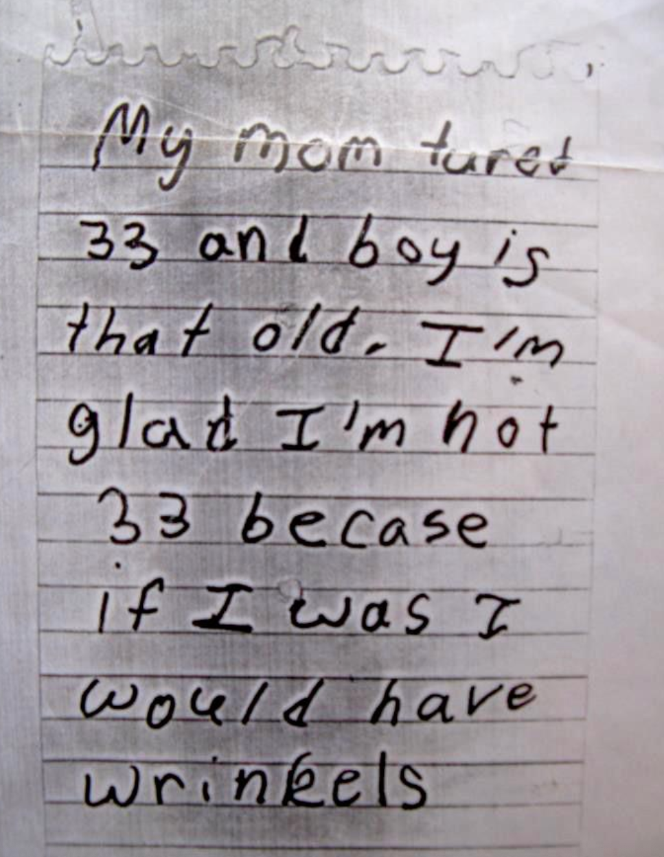 Child&#x27;s handwritten note humorously comments on their mom turning 33, expressing relief about not being that age due to potential wrinkles