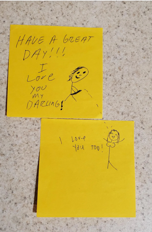 Two sticky notes with stick figure drawings and handwriting. Top note: &quot;Have a great day!!! I love you, my darling!&quot; Bottom note: &quot;I love you too!&quot;