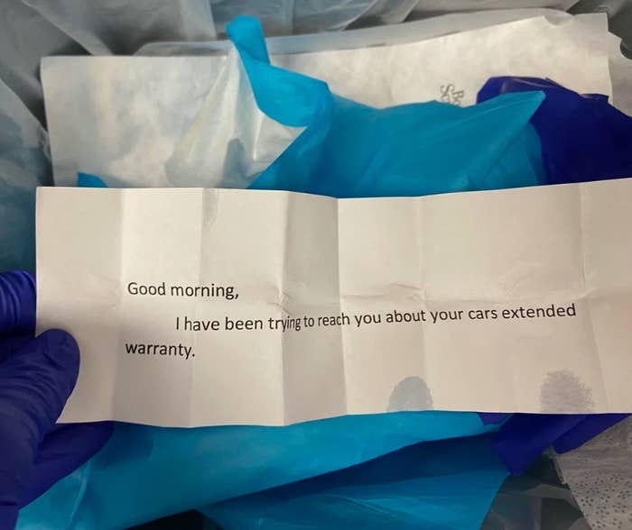A note in gloved hands reads: &quot;Good morning, I have been trying to reach you about your car’s extended warranty.&quot;