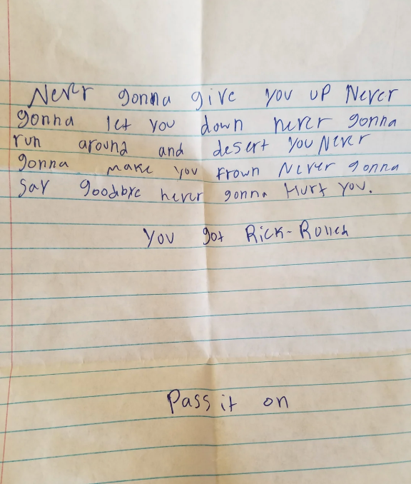 Handwritten note featuring lyrics from a popular song, humorously suggesting to &quot;pass it on.&quot;