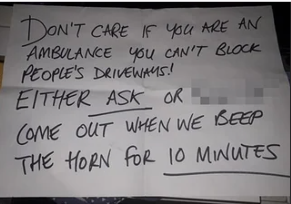 Handwritten note expressing frustration about driveways blocked by ambulances, asking to be approached or respond to horn honking