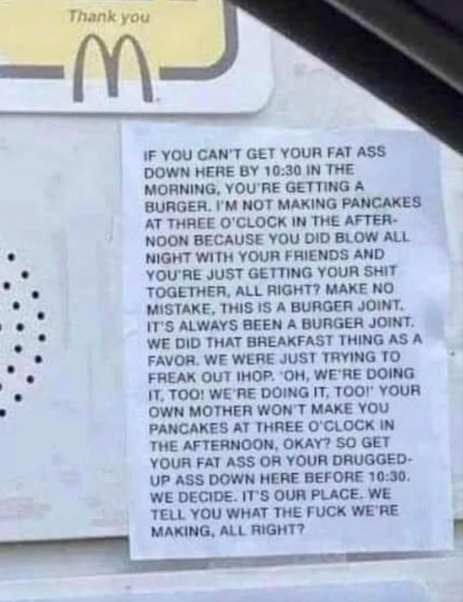 Sign on fast food drive-thru: No breakfast items after 10:30 AM. Only burgers at this burger joint