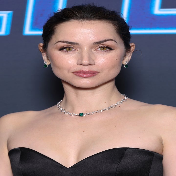 Ana de Armas in an elegant strapless dress and diamond necklace at a formal event with her hair styled up