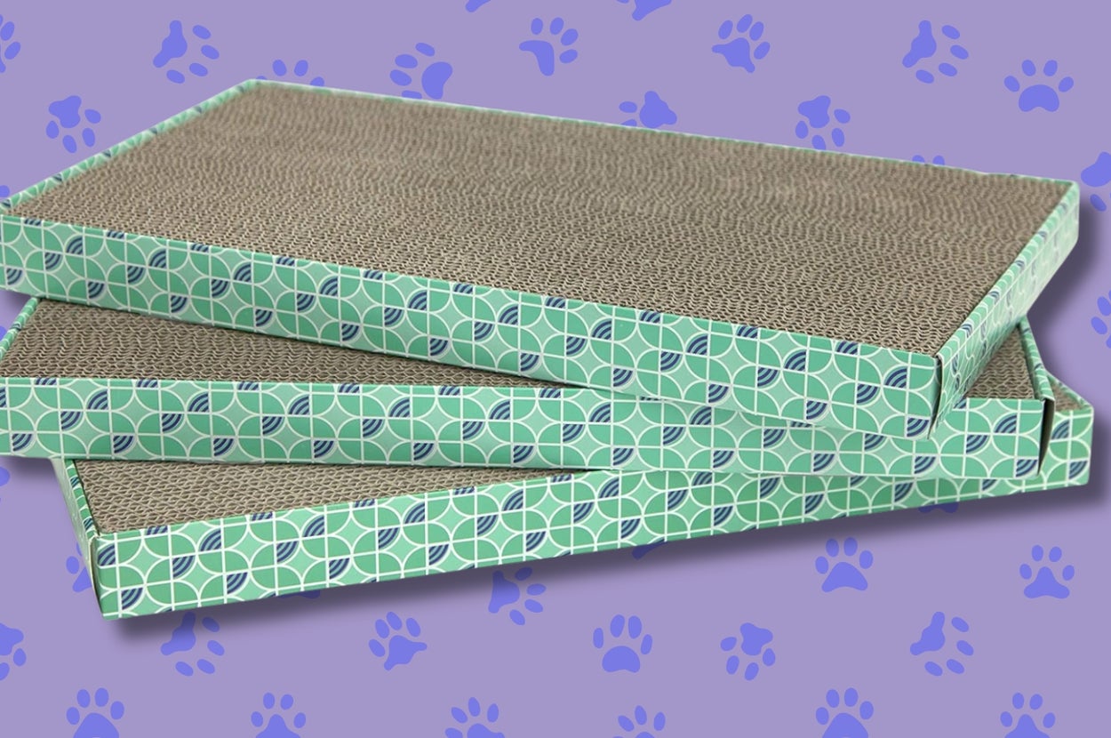Three stacked cat scratchers with a geometric pattern design, set against a background with paw prints