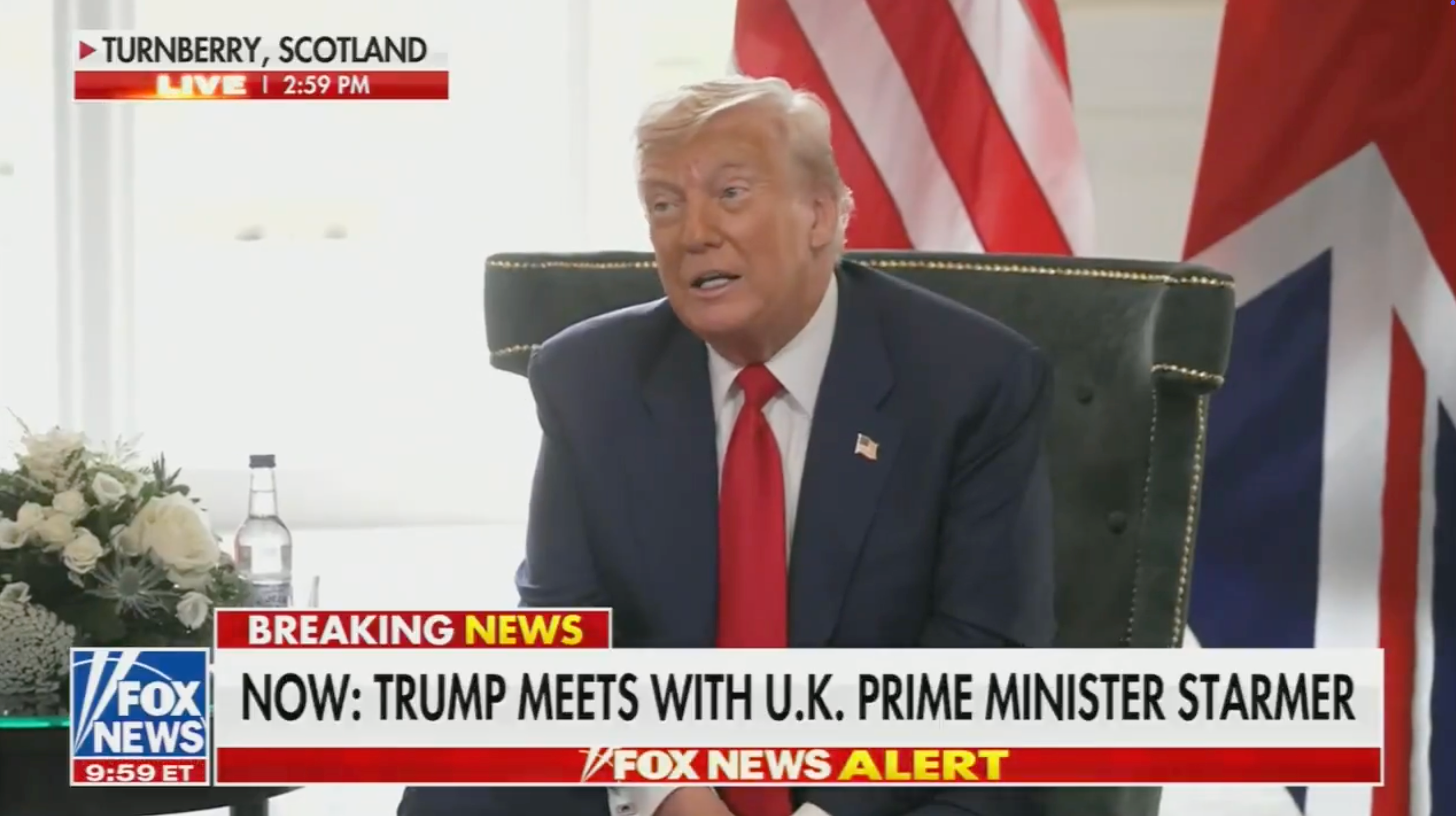 Man in suit is seated, speaking during a TV interview. Headline text reads: &quot;Trump meets with U.K. Prime Minister Starmer.&quot;