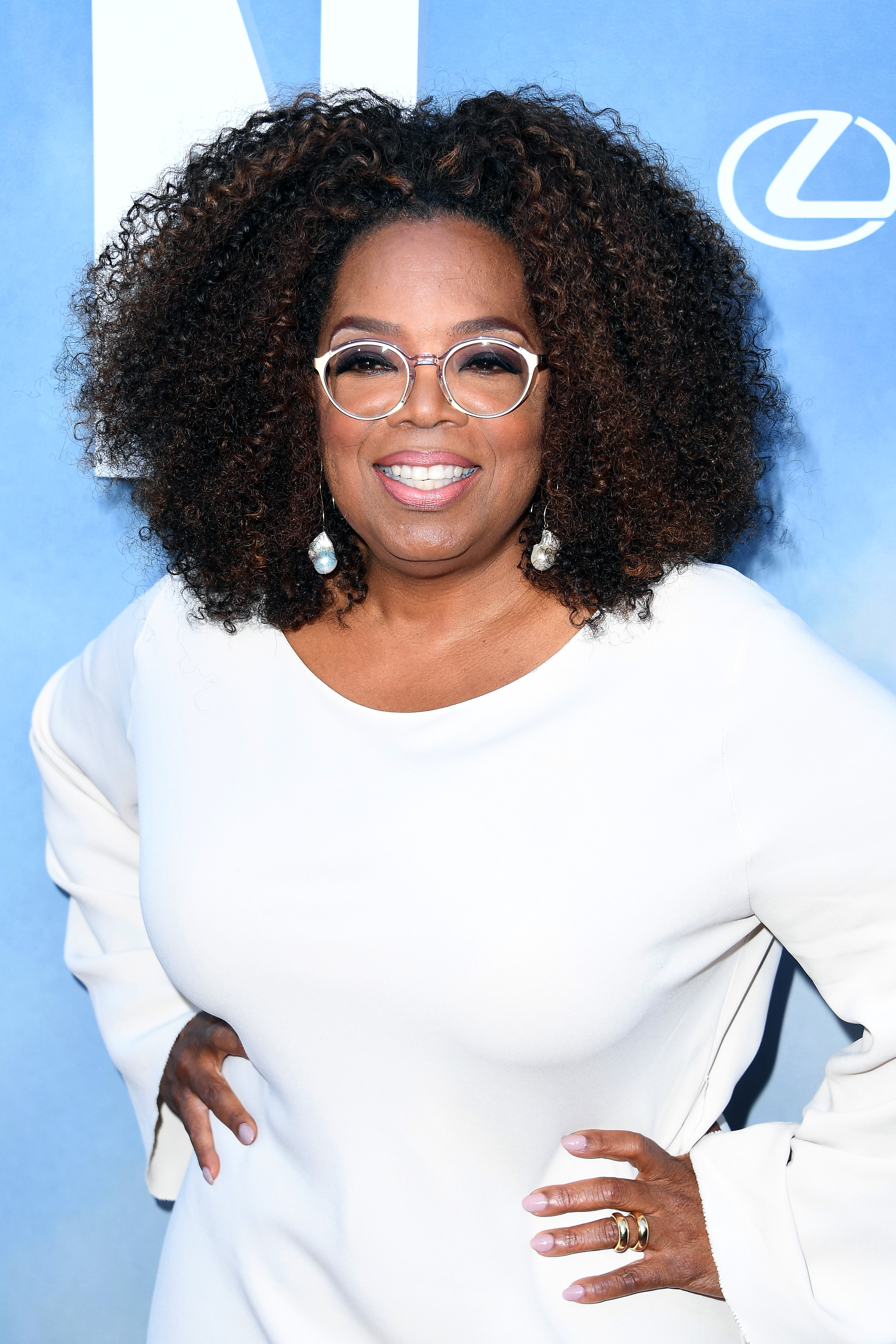 Oprah Winfrey with curly hair at an event