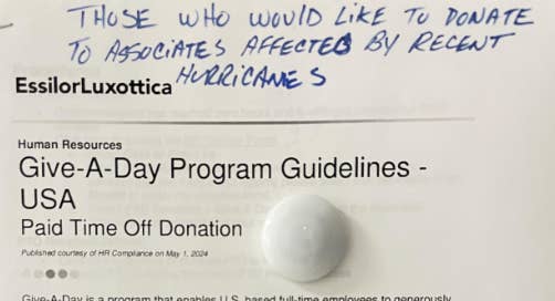 Sign about donating paid time off to help associates affected by recent hurricanes, titled &quot;Give-A-Day Program Guidelines - USA.&quot;