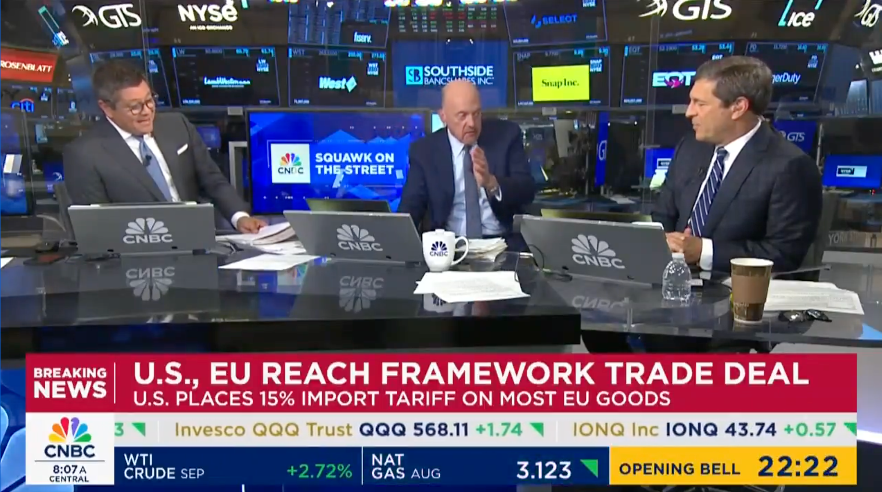 News broadcast discussing a trade deal between the U.S. and EU, with a 15% import tariff on EU goods. Three anchors are engaged in conversation
