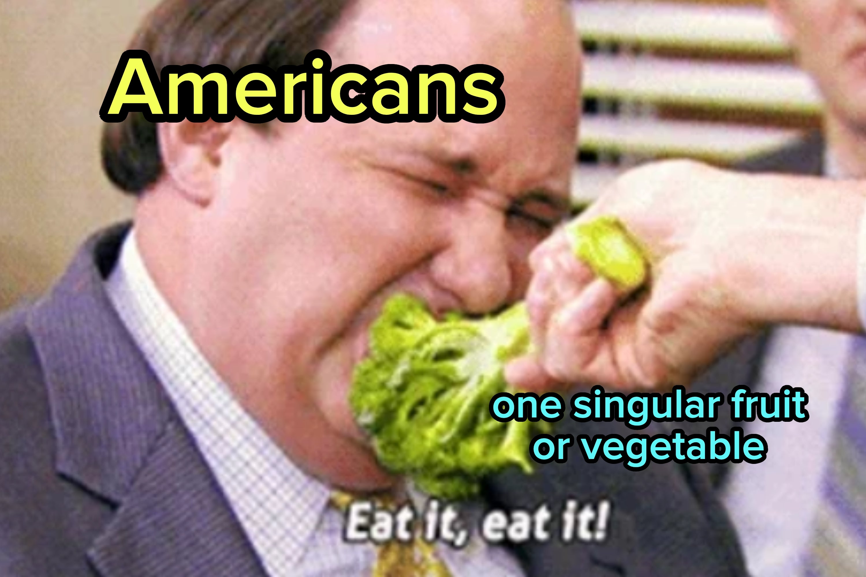 A person in a suit being playfully forced to eat broccoli, with the text "Eat it, eat it!" on the image