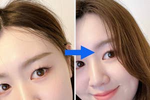 女性が上目遣いで見つめている顔の一部。前髪と片手が見えています。