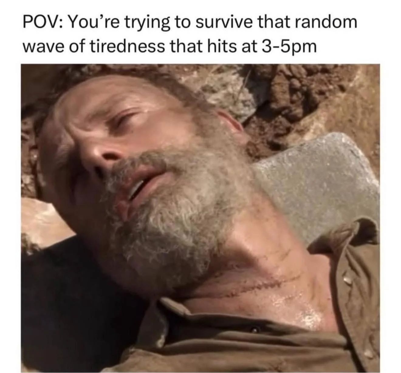 A tired man lies back on a rock with the caption: &quot;POV: You’re trying to survive that random wave of tiredness that hits at 3-5pm.&quot;