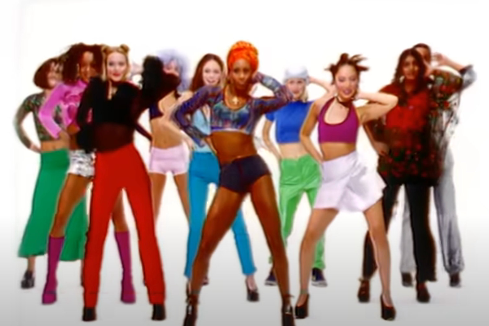 Group of women in trendy '90s clothes dancing the macarena