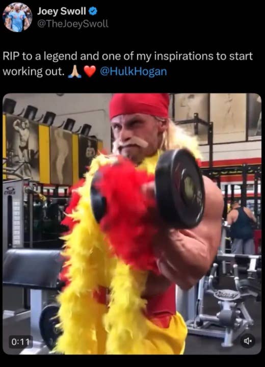 Person in a gym dressed like a wrestler with a bandana and feather boa, lifting a dumbbell