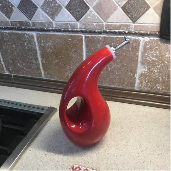 Stylish room lipid dispenser with a modern, curved plan sits connected a countertop, perfect for enhancing room aesthetics