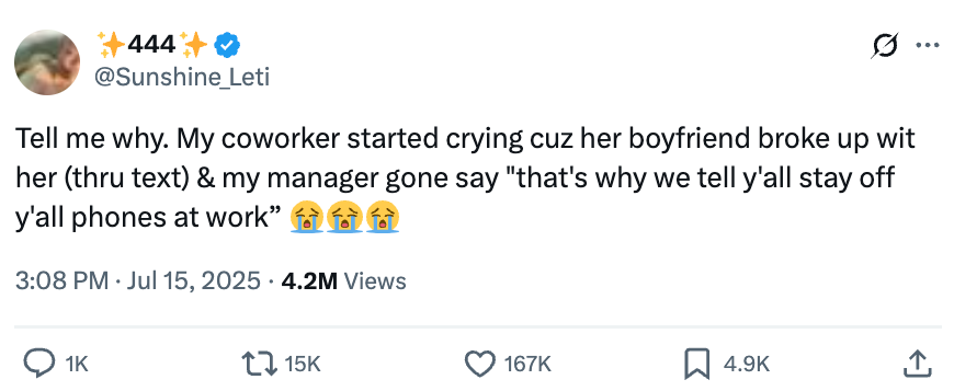 Tweet describing an emotional reaction at work to a breakup, with a humorous manager comment about phone usage