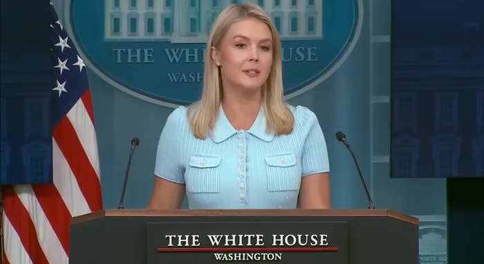 A woman at a podium speaks during a press conference at the White House in Washington
