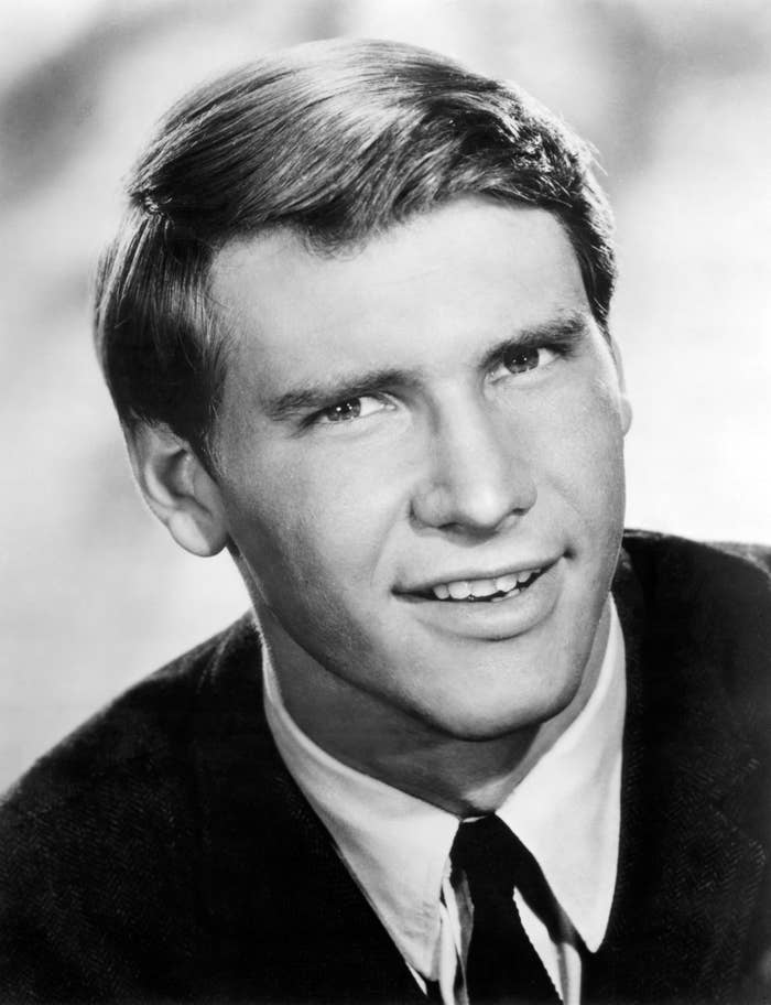 A young man in a vintage portrait, wearing a suit and tie, looking directly at the camera with a slight smile