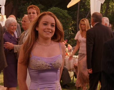 freaky friday purple dress Lindsay Lohan Recreates Iconic 'Freaky Friday' Look With Guitar Bag & Metallic Dress