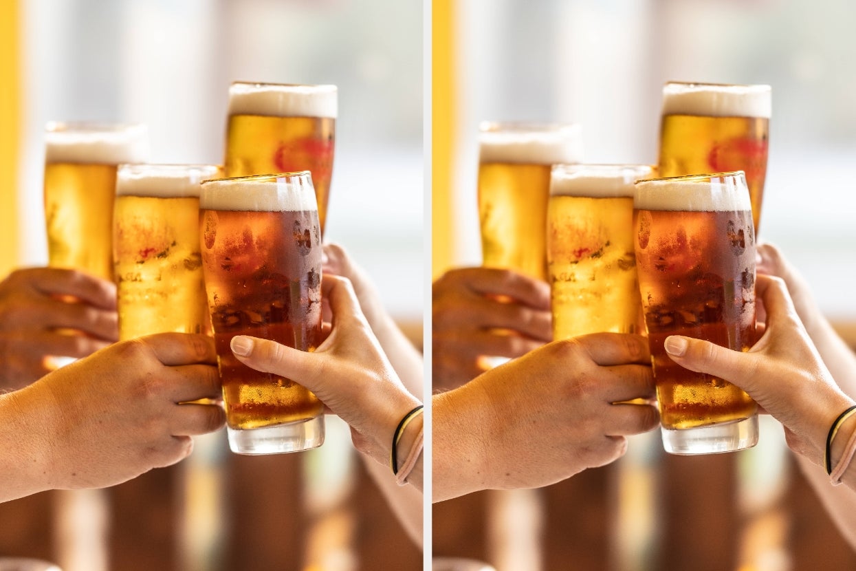 People clinking glasses of beer in a celebratory toast