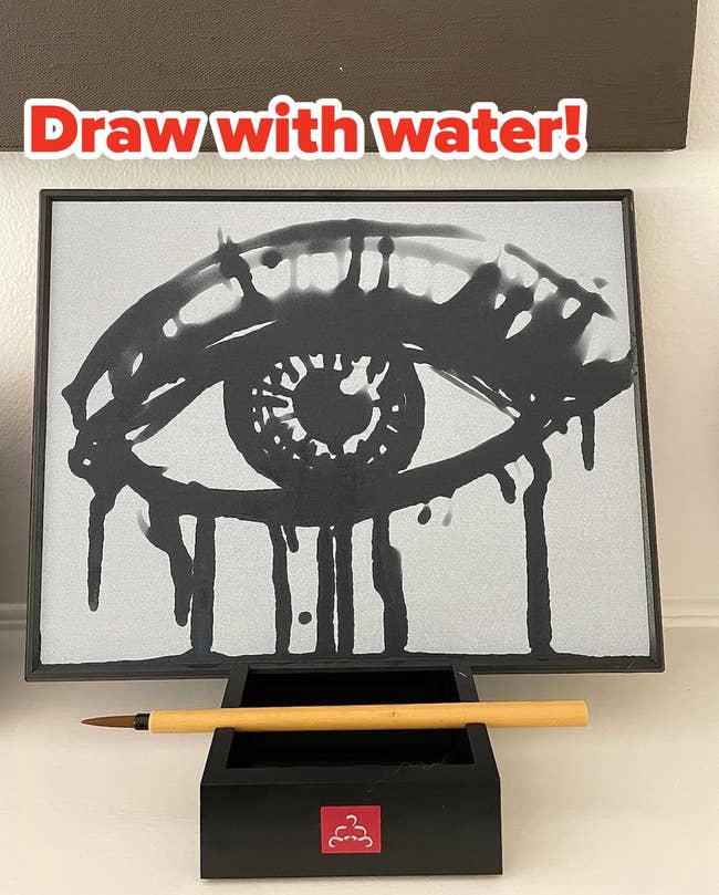 Artistic oculus illustration with dripping overgarment effect connected a stand, featuring a brush. Art decor for a stylish space