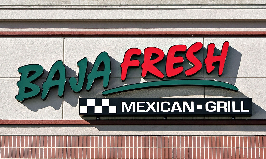 Baja Fresh Mexican Grill storefront sign with bold lettering on a brick and tile background