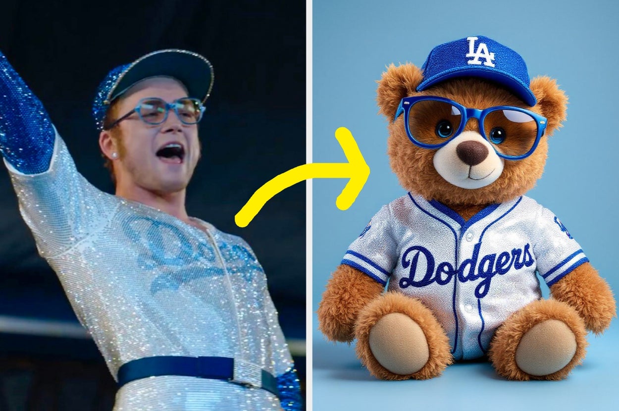 Taron Egerton in glittery Dodgers outfit cheers; next to teddy bear in matching Dodgers outfit. Yellow arrow connects the two