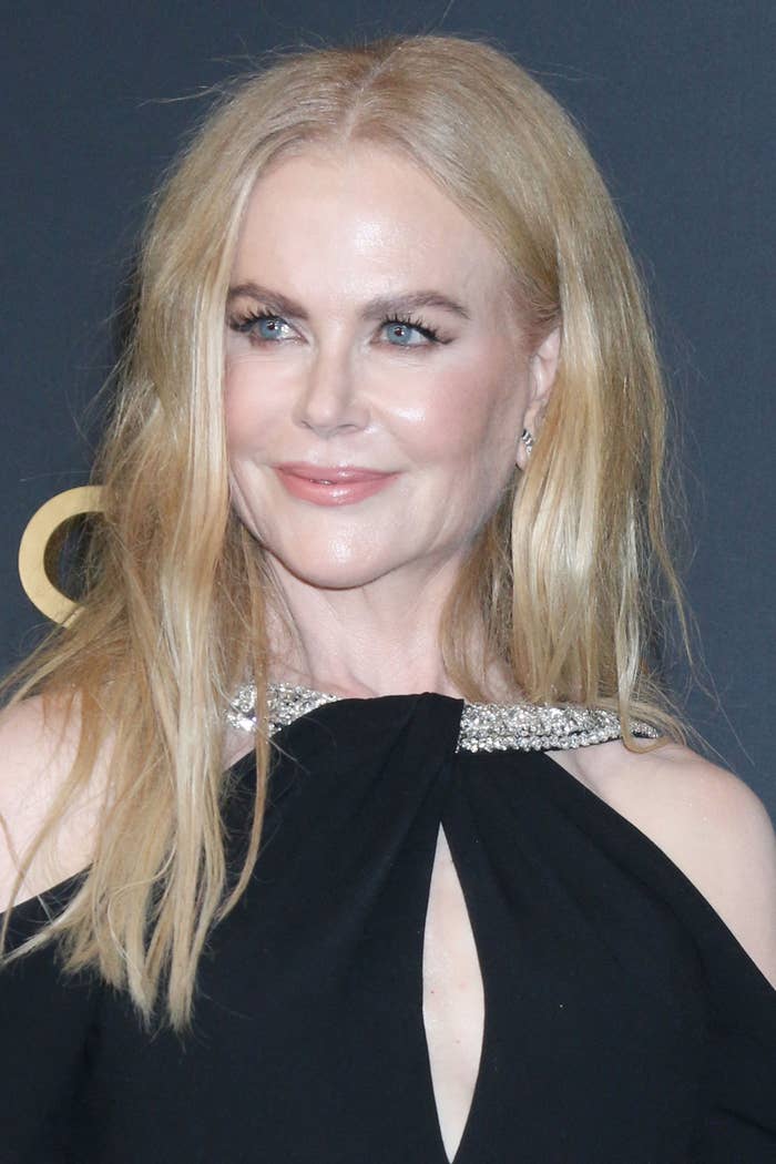 Person successful elegant achromatic formal with sparkling neckline, attending an event