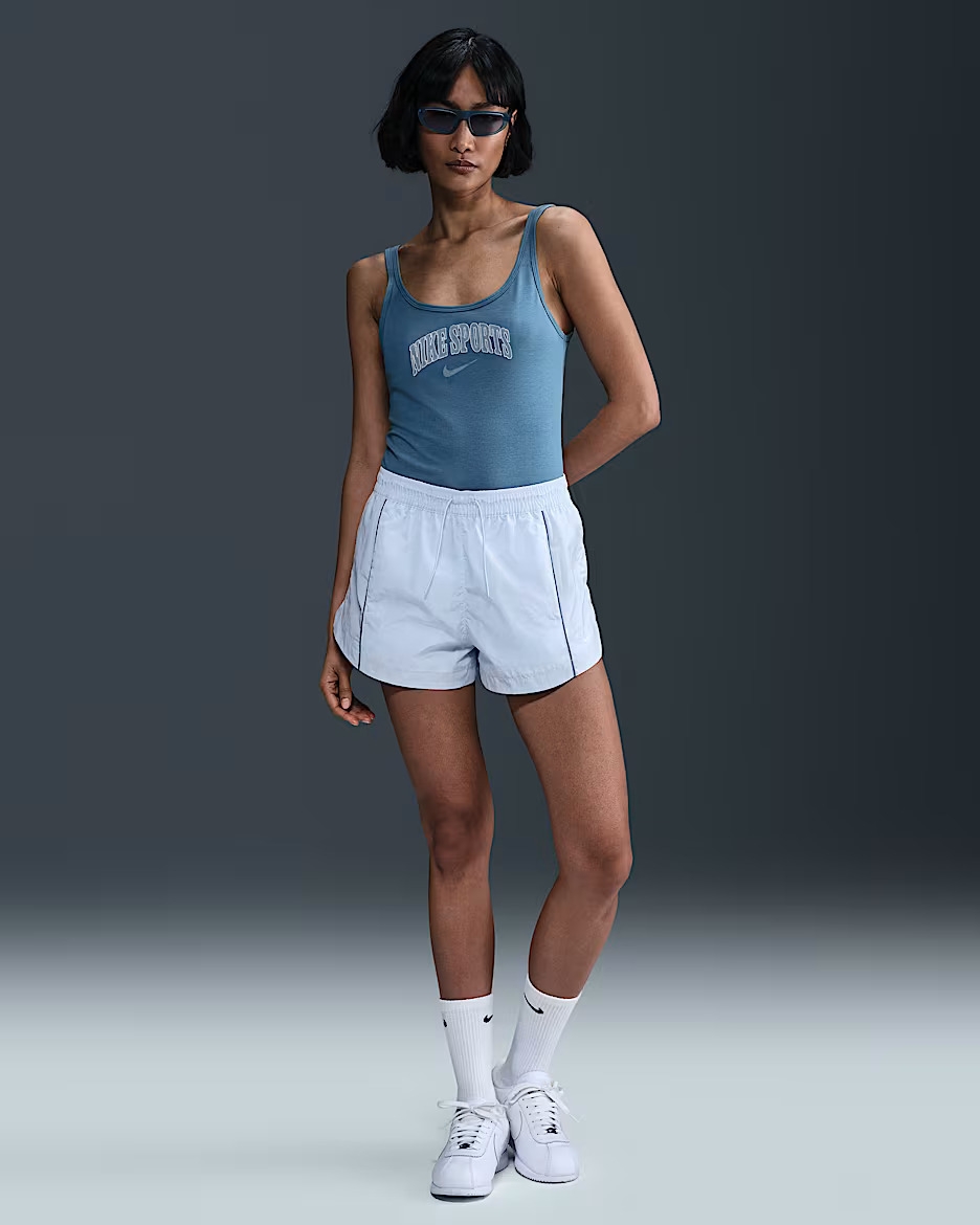 Model wearing the white shorts