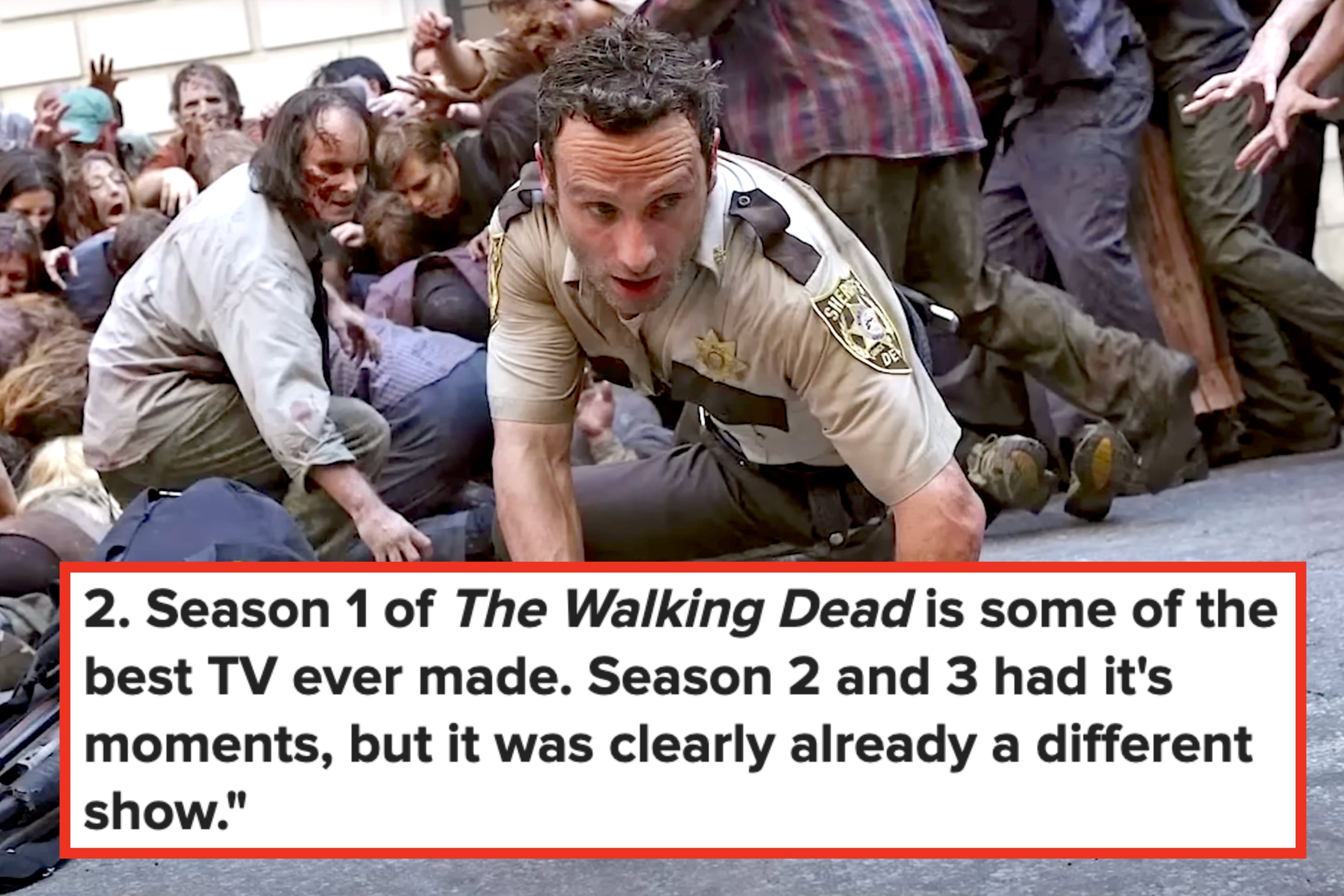 A man in a sheriff's uniform crawls on the street, chased by a horde of zombies. A police bag with a shotgun is on the ground nearby
