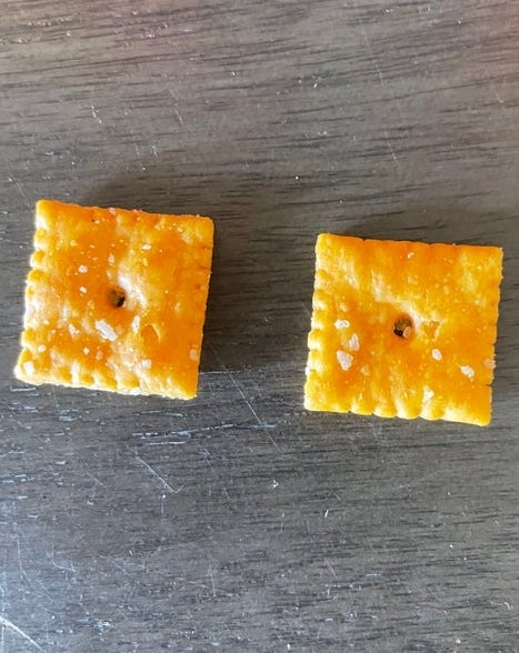 Two Cheez-Its side by side on a wooden table