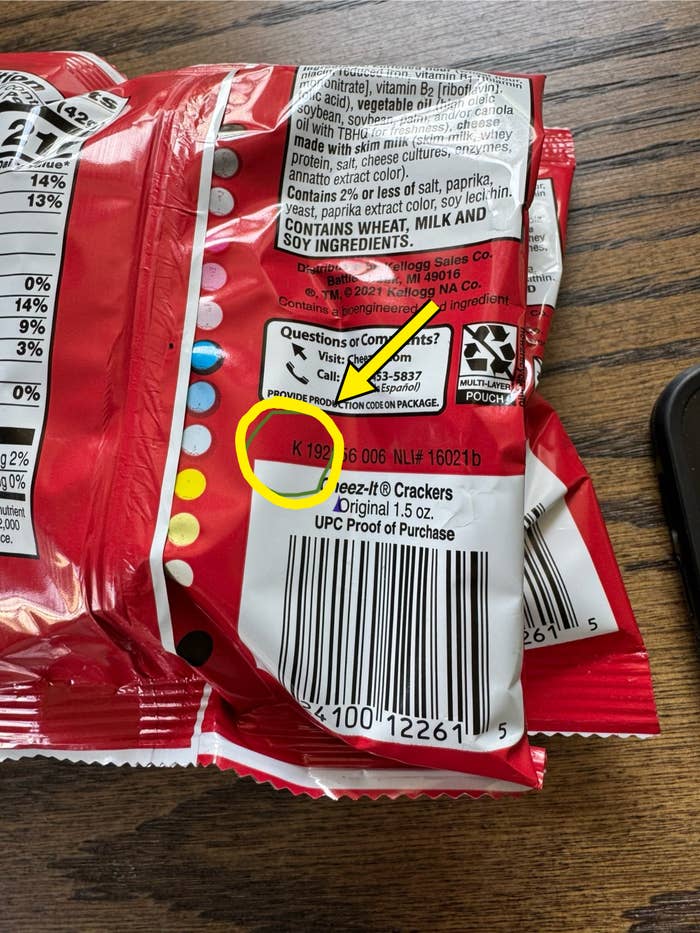 Back of a Cheez-It crackers package showing the nutrition label, UPC bar code, and a contact section for questions or comments