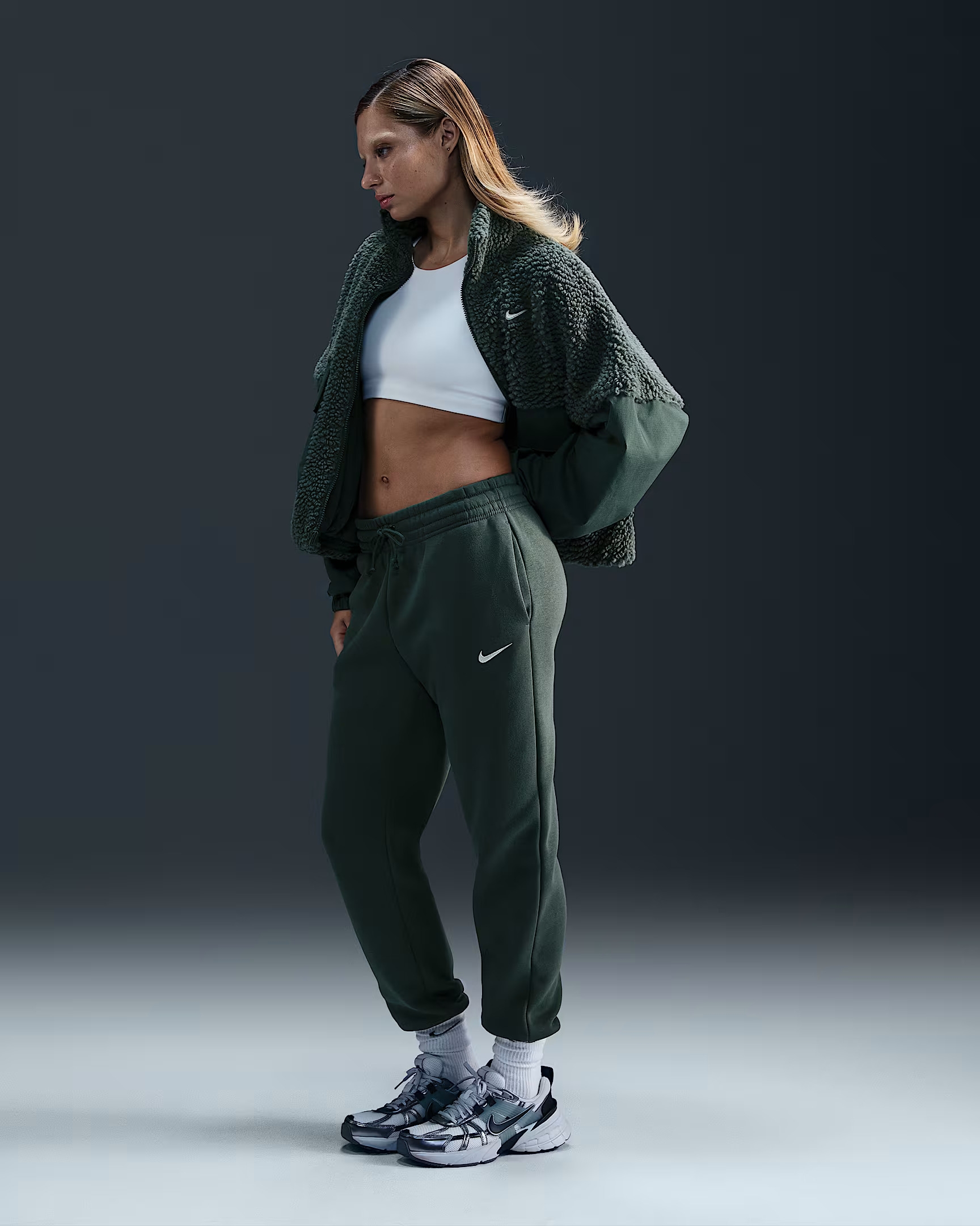 Model wearing the green sweatpants