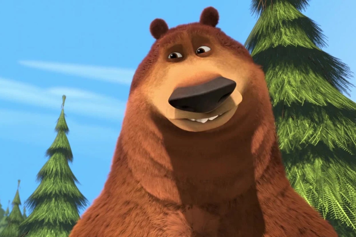 Animated bear smiling with trees in the background