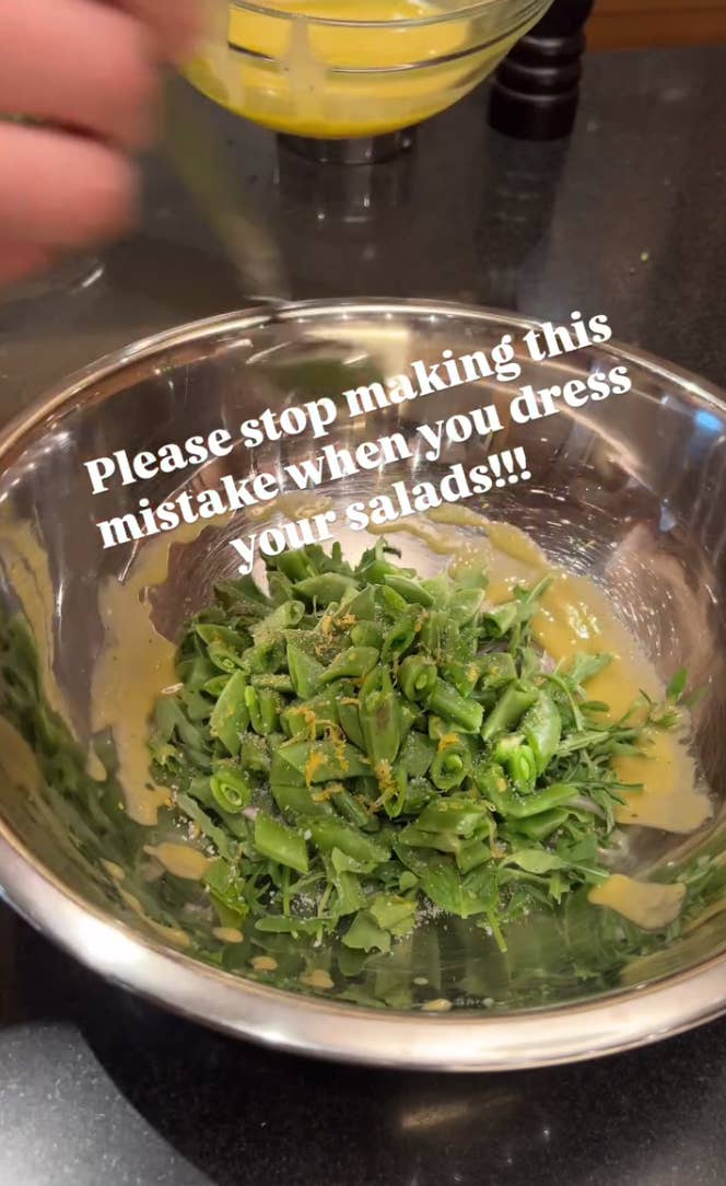 Text on image: "Please stop making this mistake when you dress your salads!!!" Salad in a bowl with dressing being poured