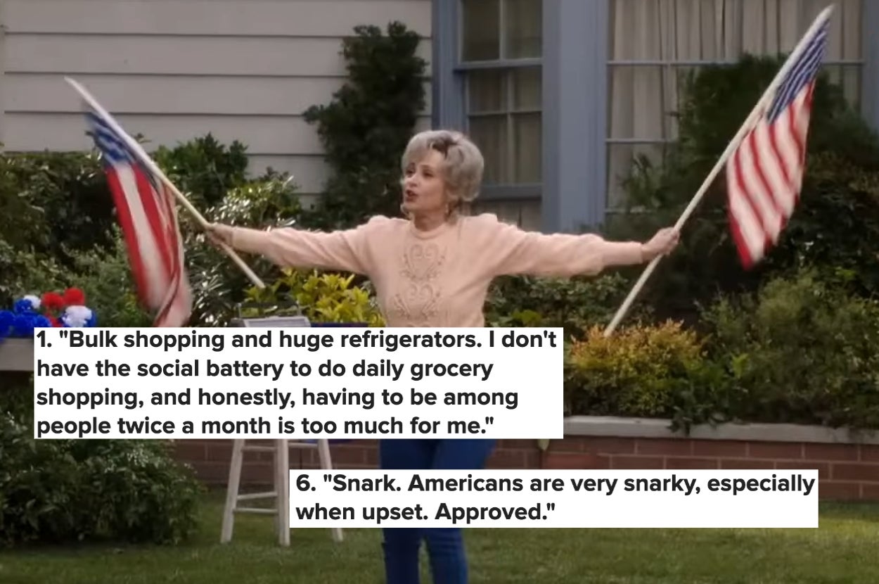Woman holds flags outside a house with text about bulk shopping, social battery limits, and Americans being snarky