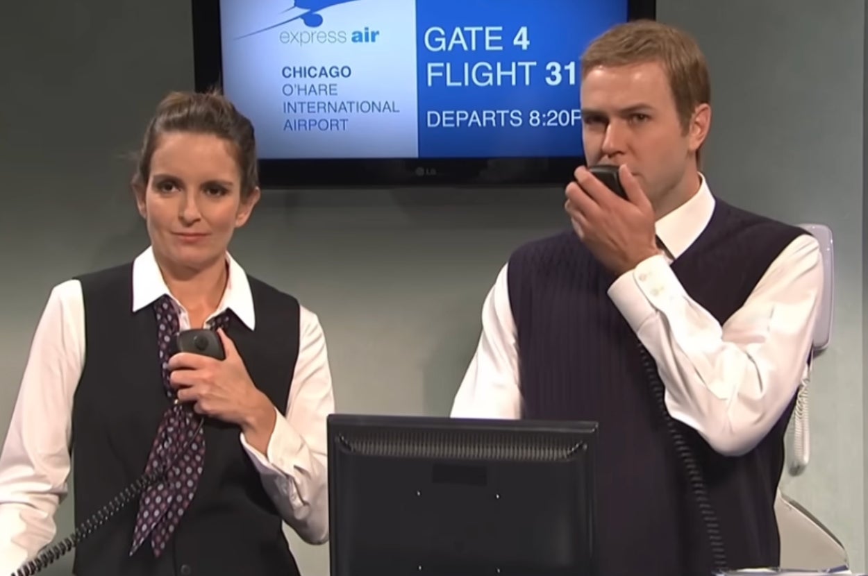 Two flight attendants with microphones stand at an airport gate desk. A screen behind them shows flight details for Gate 4, Flight 312 to Chicago