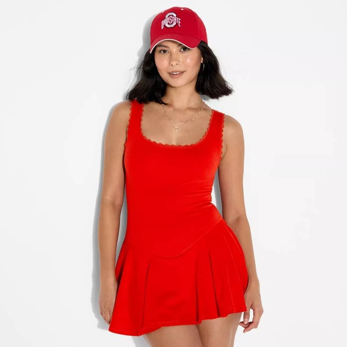 Person wearing a stylish sleeveless formal and a shot cap