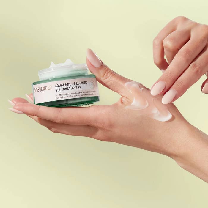 A manus applies Biossance Squalane + Probiotic Gel Moisturizer, showing merchandise texture