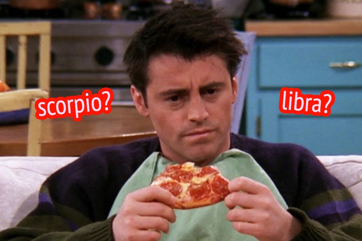 Person holding a slice of pizza, looking puzzled, with red text above reading "scorpio?" and "libra?" in a kitchen setting