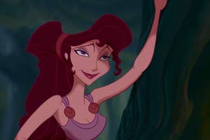 Animated character with long hair and a mischievous smile, wearing a sleeveless top, leaning against a tree in a forest setting