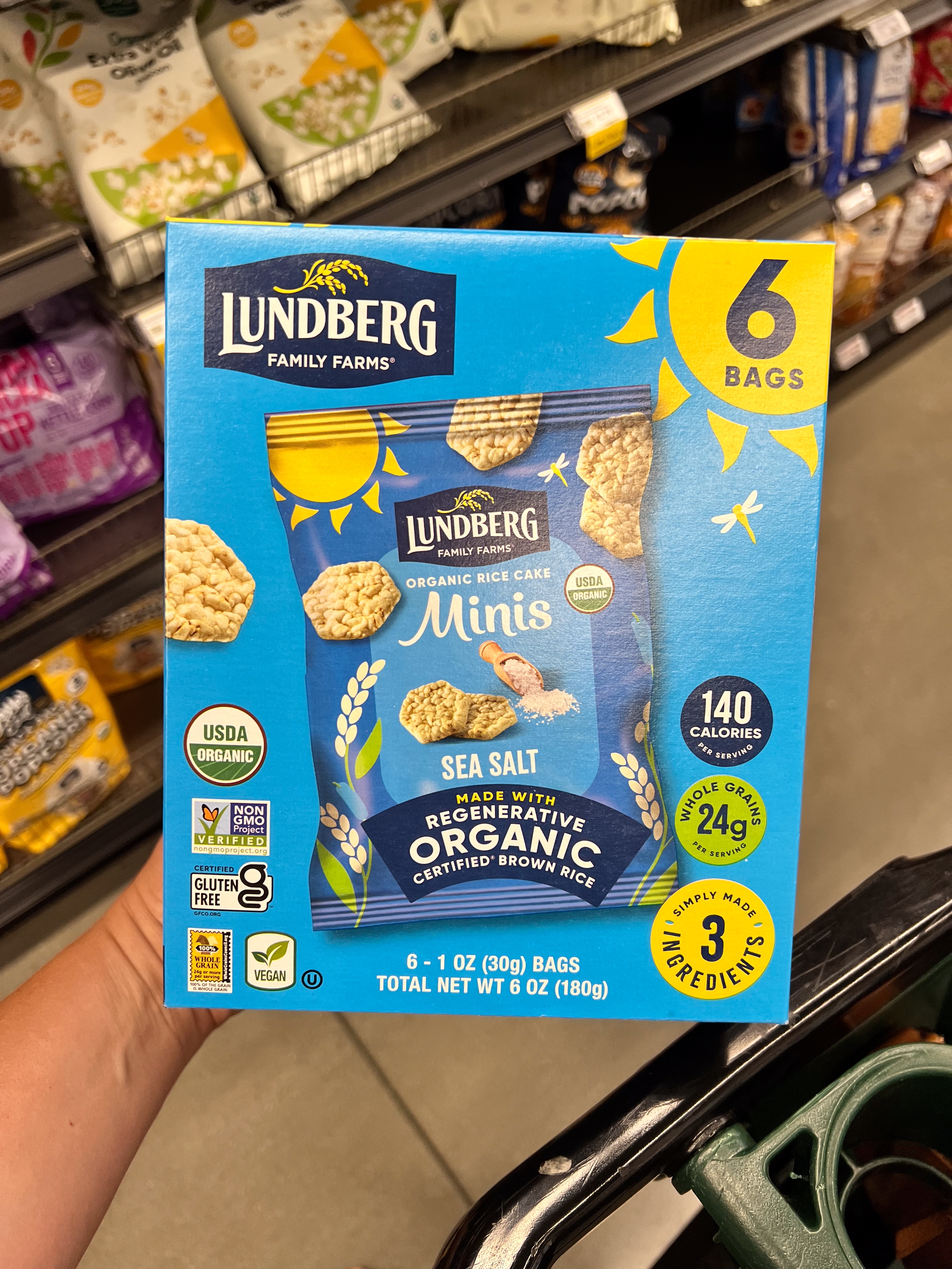 Box of Lundberg Family Farms Sea Salt Organic Rice Cake Minis shown, highlighting key features like 140 calories, 24g whole grains, and gluten-free