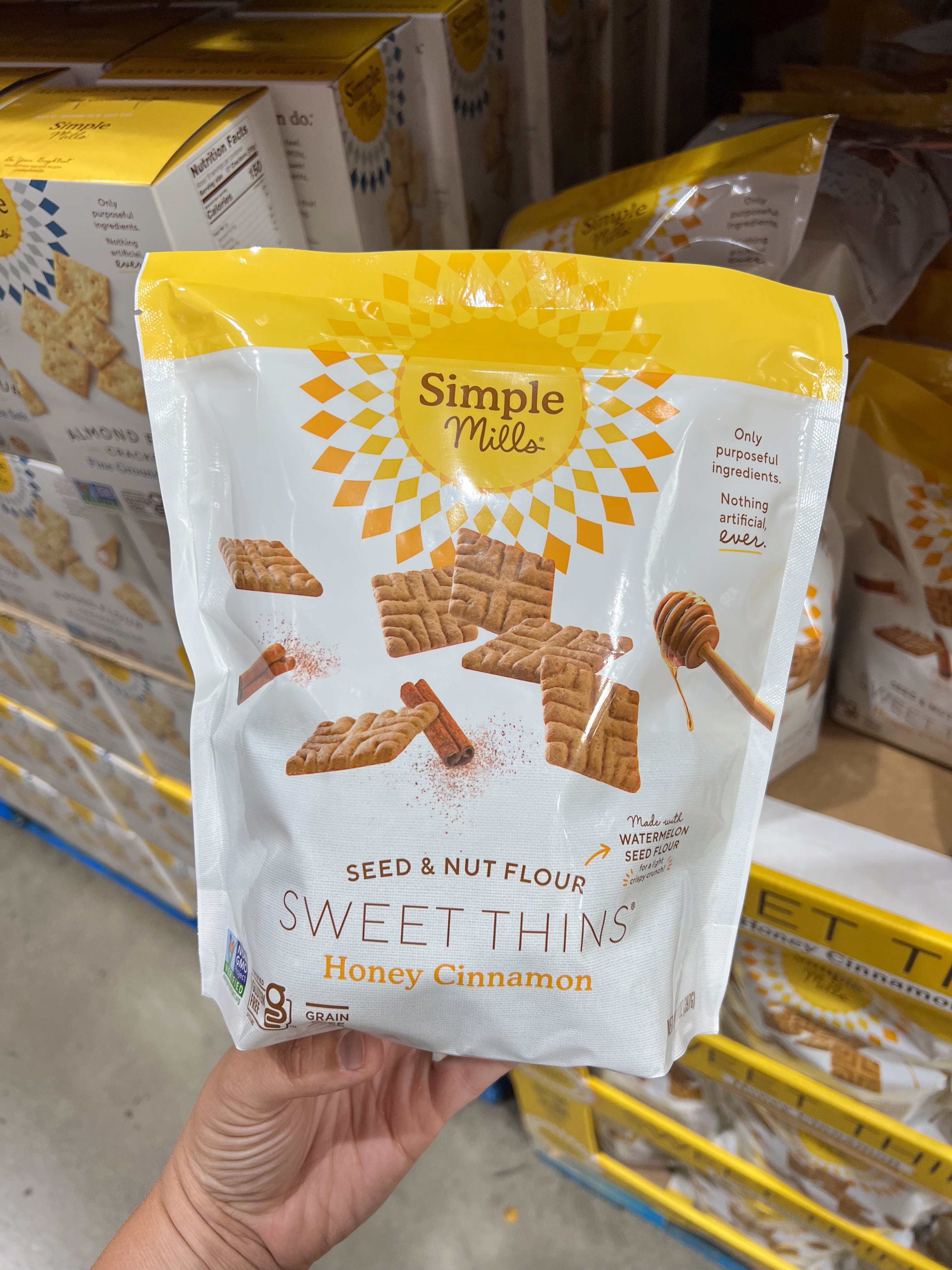 Bag of Simple Mills Sweet Thins in Honey Cinnamon flavor. Packaging highlights seed and nut flour ingredients, promoting it as gluten-free and nutritious