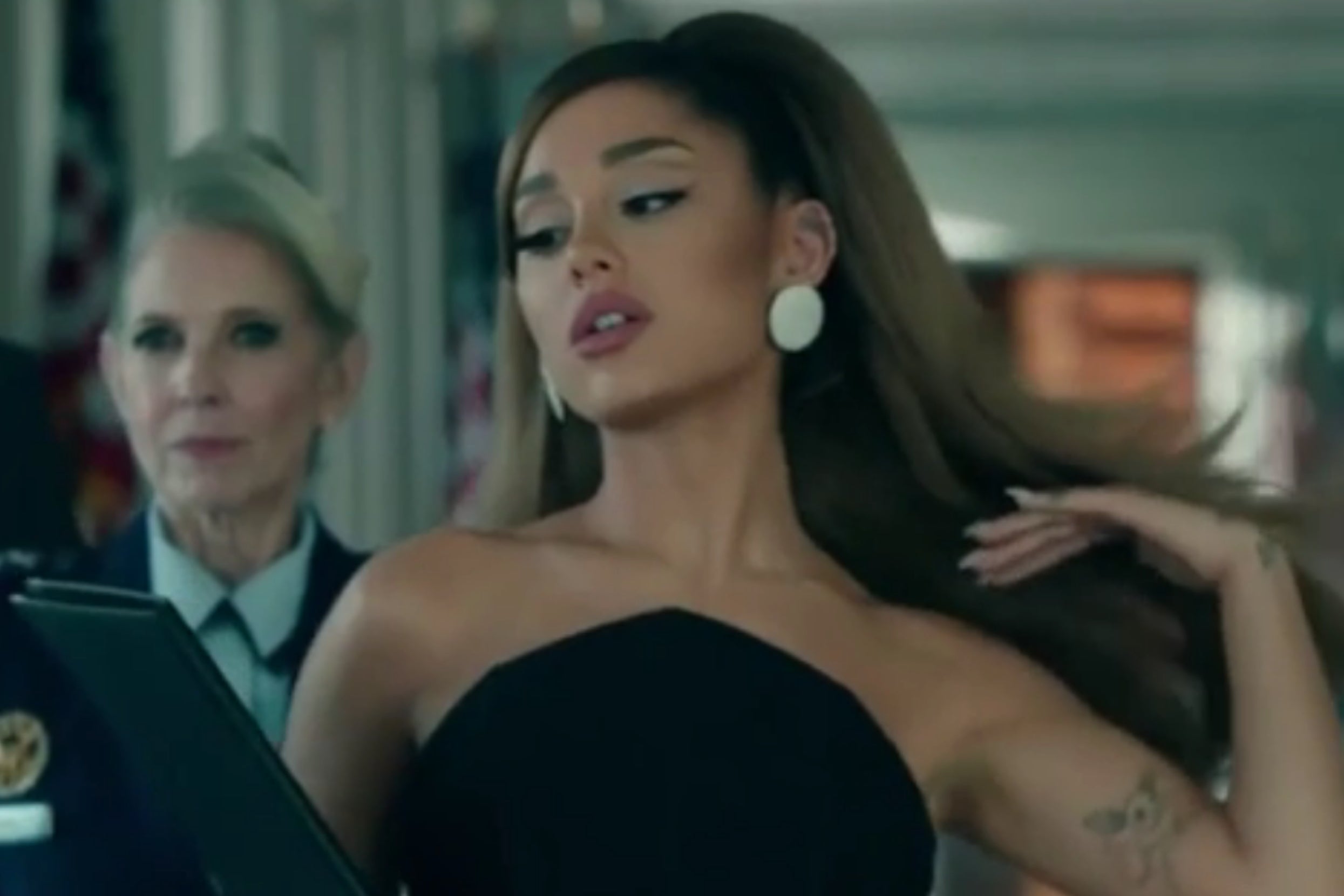 Ariana Grande flipping her hair in the Positions music video
