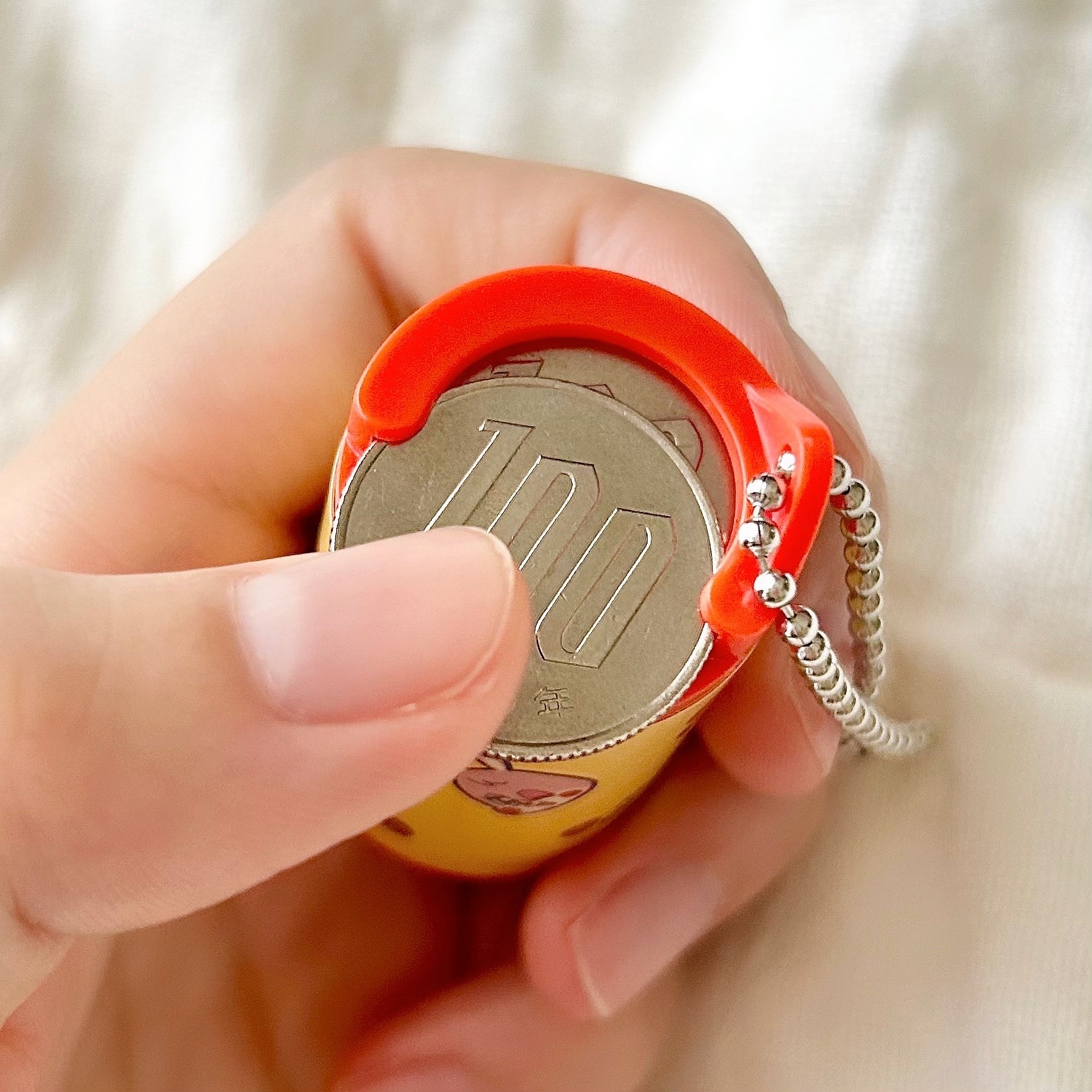 CanDo(キャンドゥ)の「100円玉コインケース レトロ」