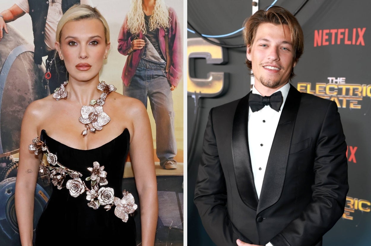 Two celebrities at an event; one in an elegant black gown with floral embellishments, the other in a classic black tuxedo with a bow tie