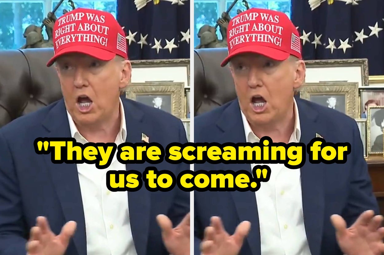 A person in a suit sits at a desk wearing a red hat with the text "Trump was right about everything."